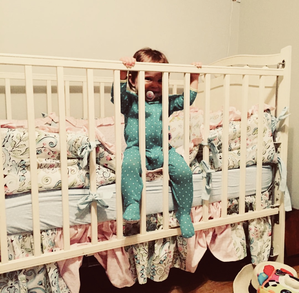 Baby-Peeking-Through-Crib-Rails