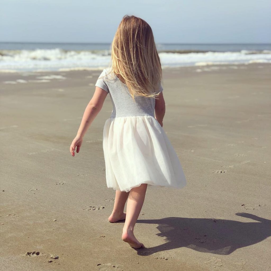 young-girl-walking-beach